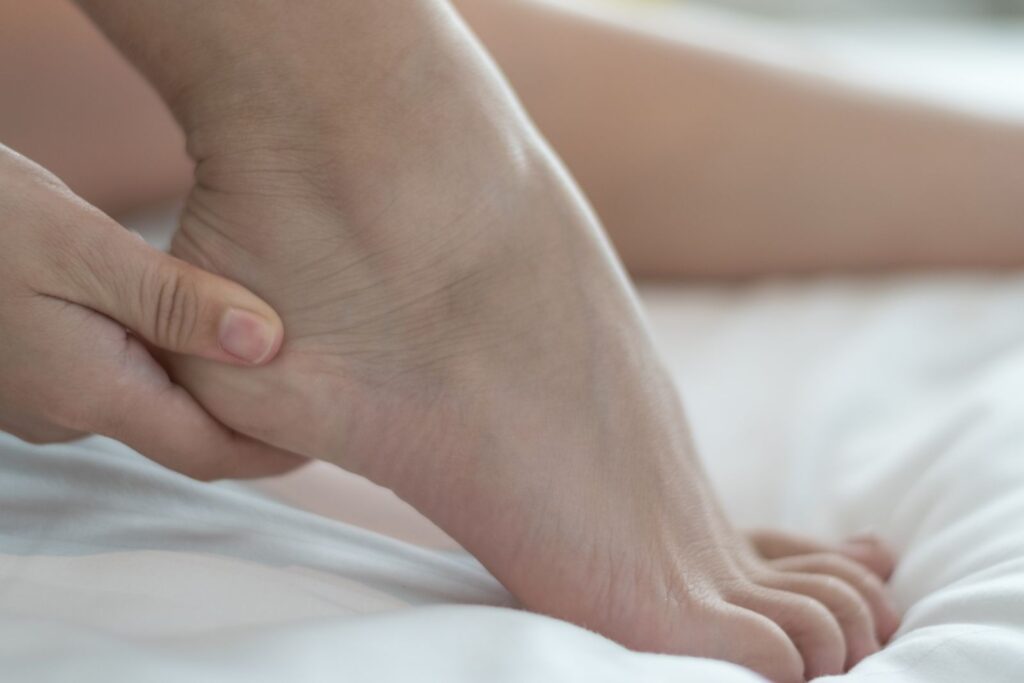 What is the cause of heel pain and how is it treated?